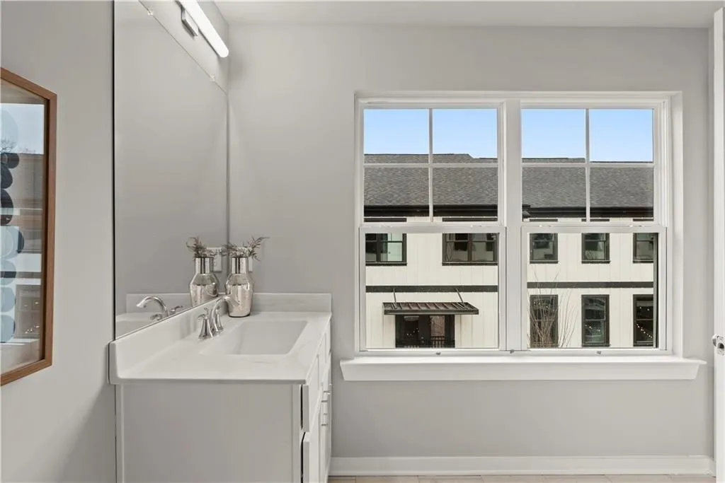 Bathroom featuring vanity and light tile patterned floors