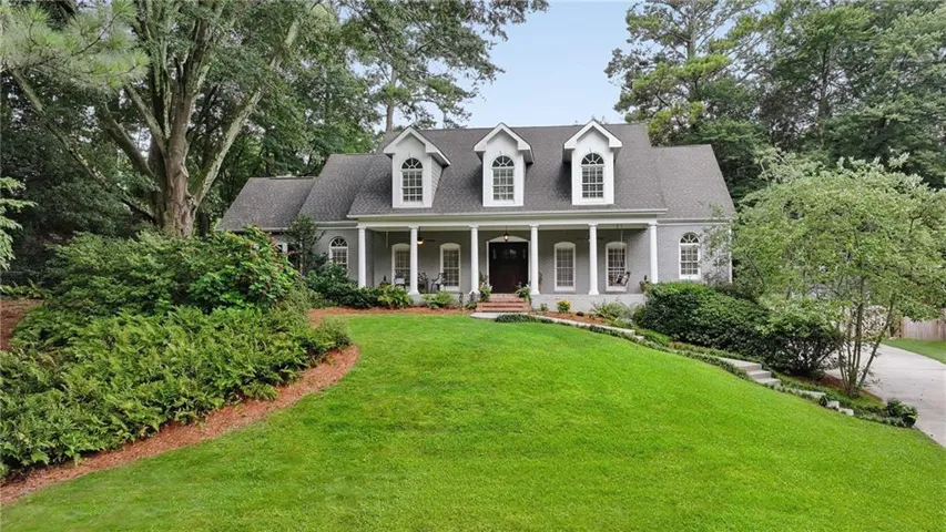 Beautiful French traditional  home in the Westminster neighborhood, a Buckhead favorite. Note the welcoming expansive front porch and lush large green lawn. Tucked away at the end of the Westminster Circle cul de sac, it offers convenience plus privacy.