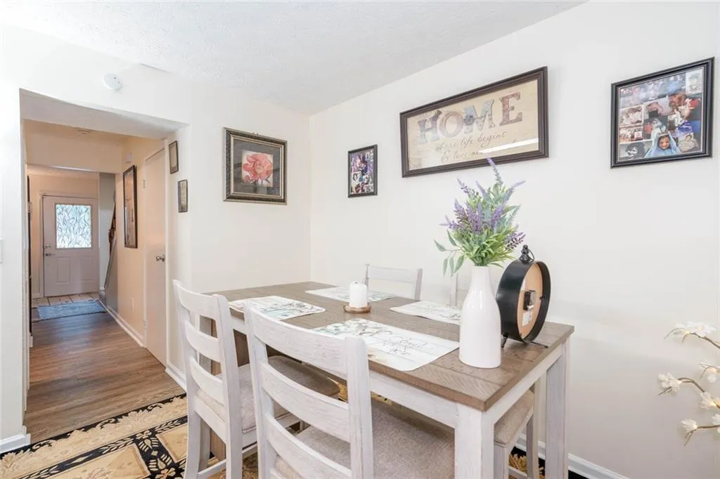 Dining area with hardwood / wood-style floors