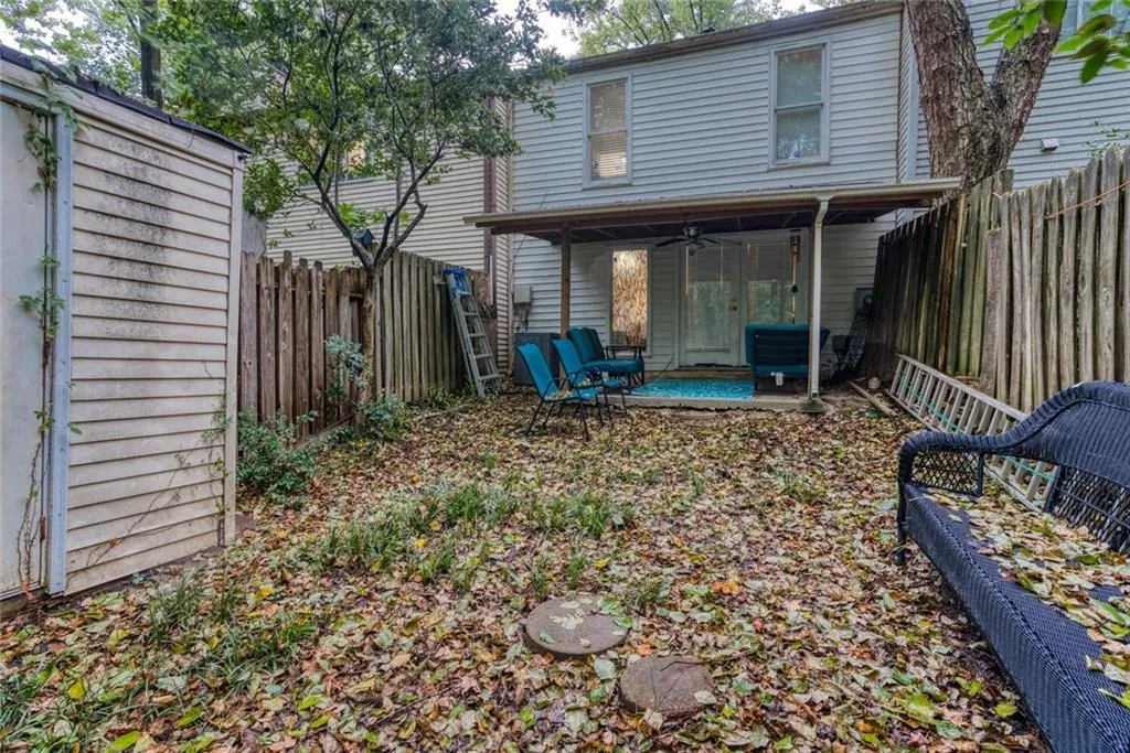 Back of property featuring a patio and ceiling fan