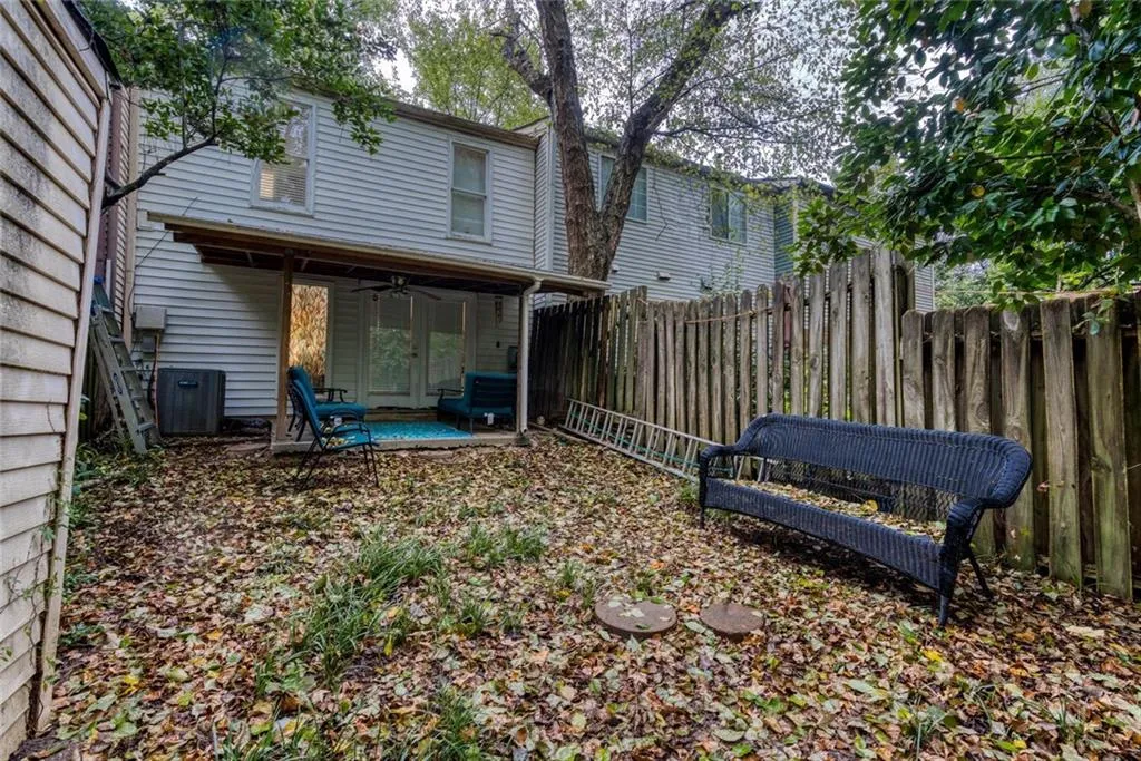 View of yard with ceiling fan, a patio area, and central air condition unit