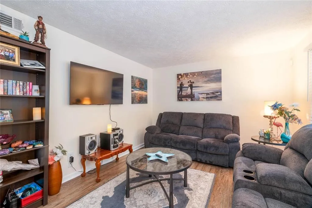 Living room with a  light wood-type flooring