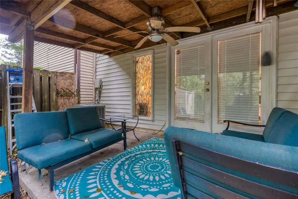 View of patio with ceiling fan, outdoor furniture can stay with the home.