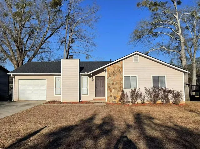 Ranch-style home with a garage