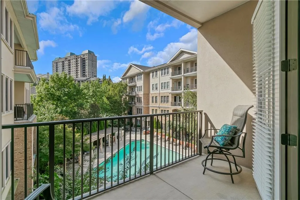 Oversized covered balcony overlooks pool