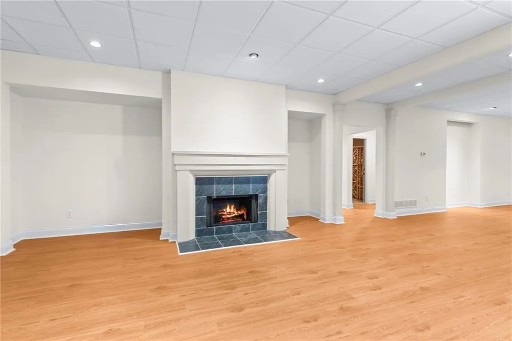 Two alcoves flanking the fireplace are ideally suited for built-ins or shelving units for games and trophys!