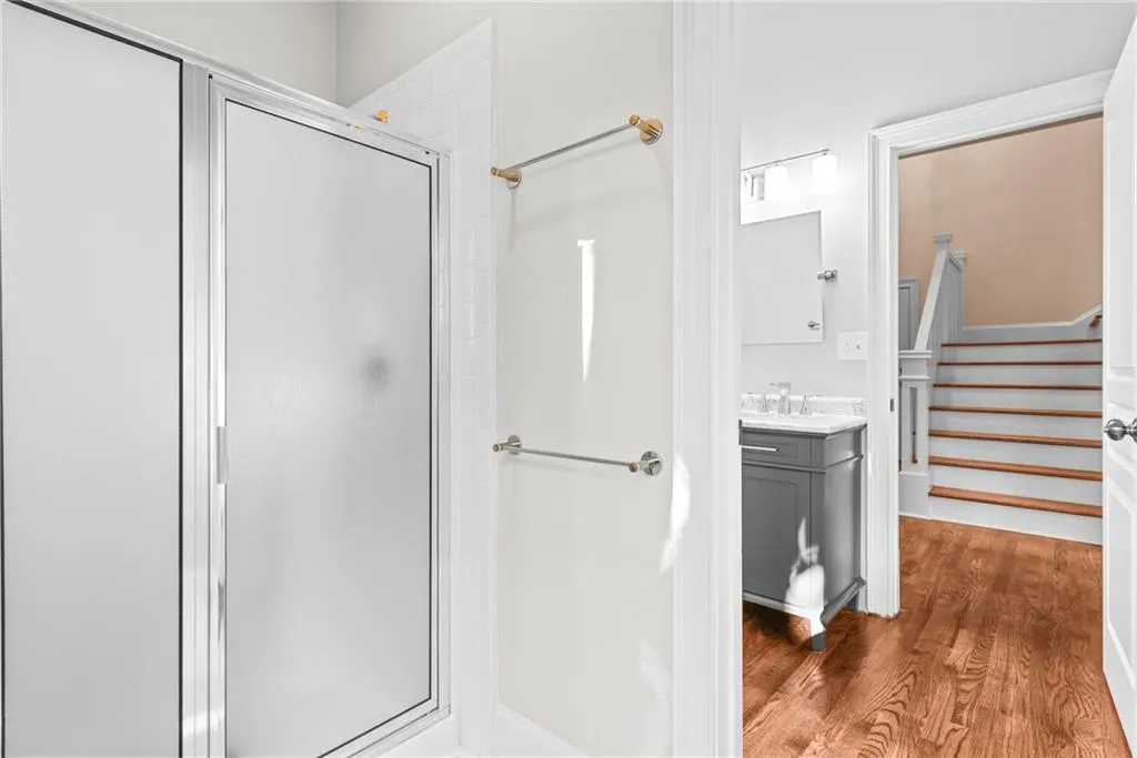 Coming in from the outside through the full pool bath with shower