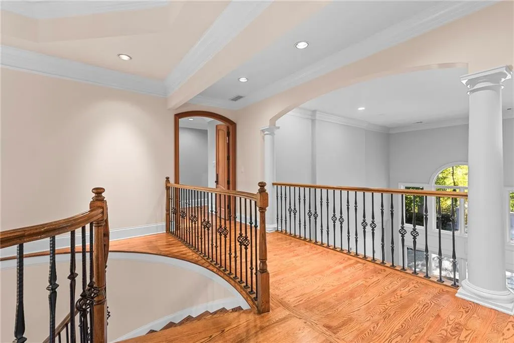 Enter the primary bedroom through these double arched doors...
