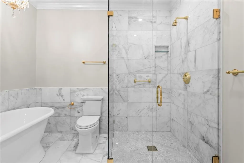 Gilded gold accent make this bathroom truly special!