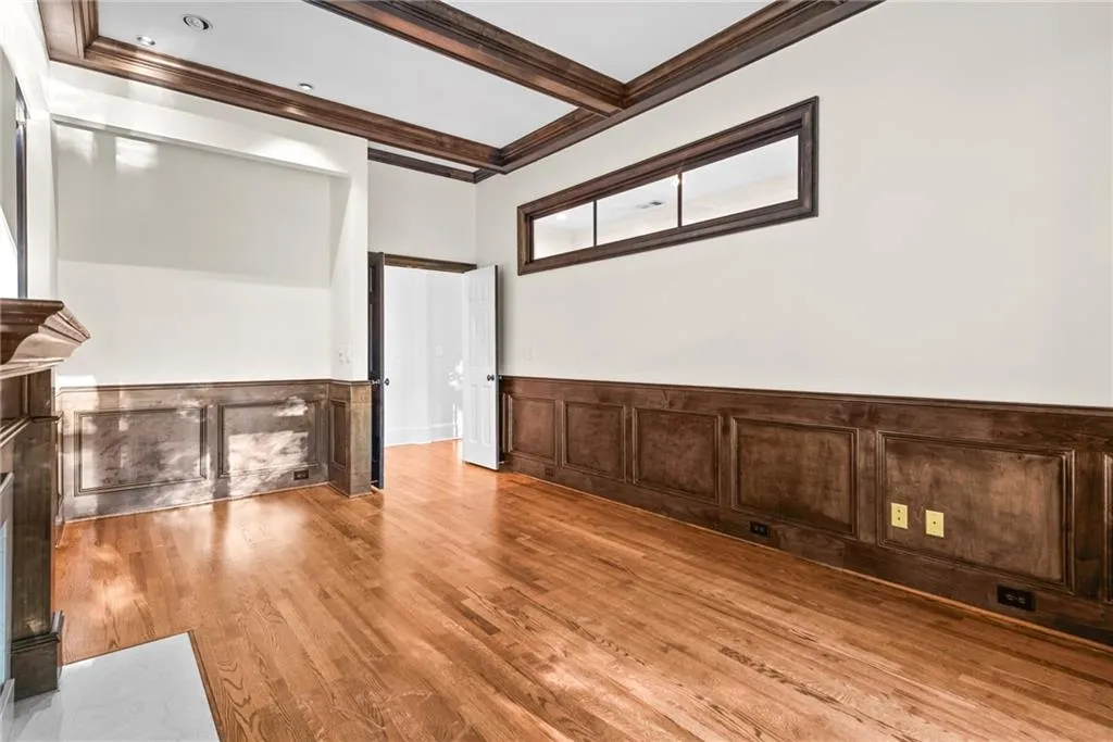 Large picture window and sidelight provide lots of natural light in this office/library!!