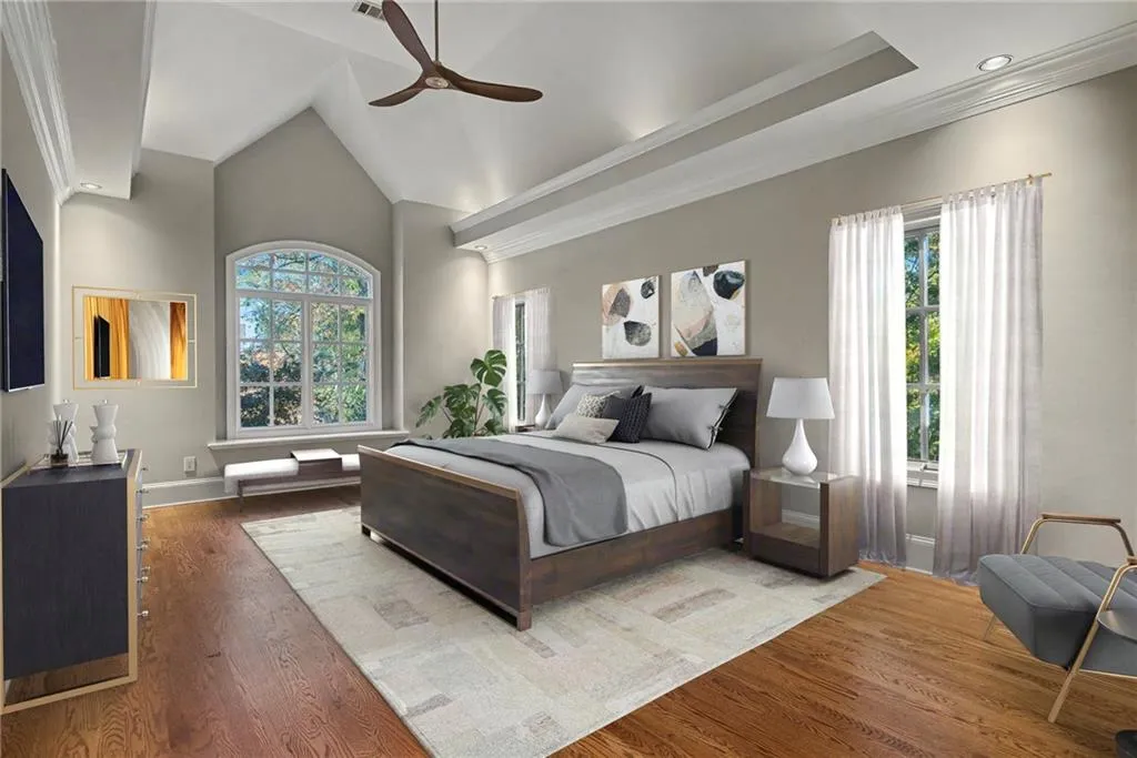 Beautiful windows provide natural light, cove lighting and modern ceiling fan