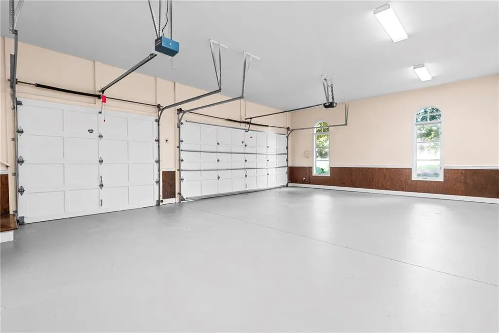 Tree car garage - with natural lighting and fresh paint walls & floor.