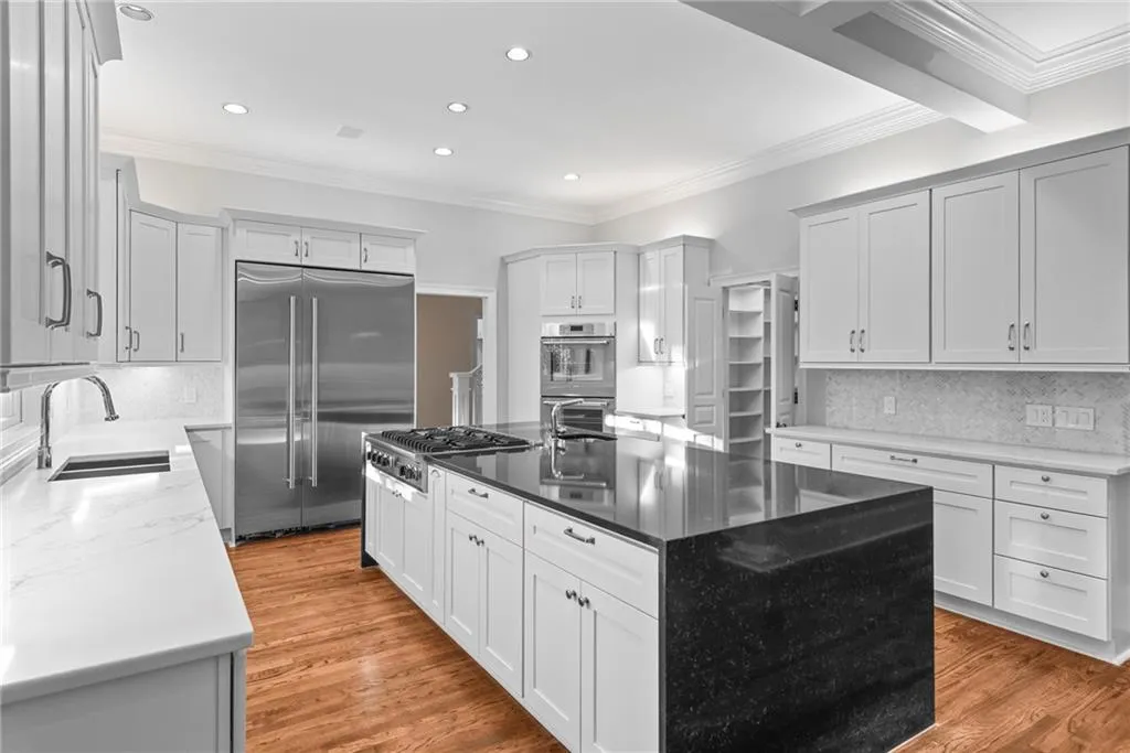 Double wide island with 6 burner Viking Cooktop and prep sink!