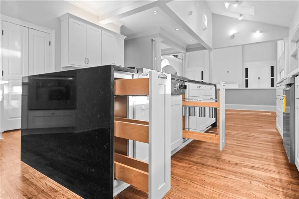 Waterfall features on kitchen island and wet bar