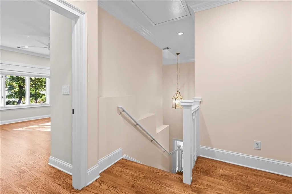 Second staircase down to the main living space - this one enters the kitchen area and side entry.