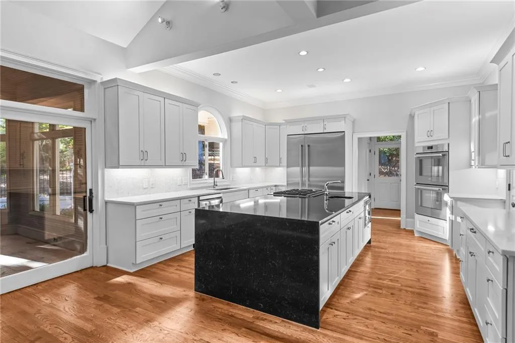 Well planned kitchen has high end appliances - double Thermador Wall ovens.