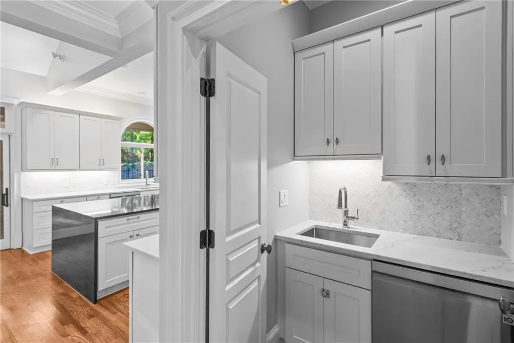 Updated butlers pantry includes dishwasher, sink and cabinetry located between kitchen and dining room!