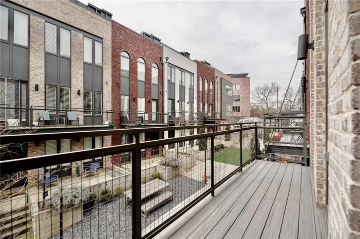 Private balcony with composite decking and metal railings