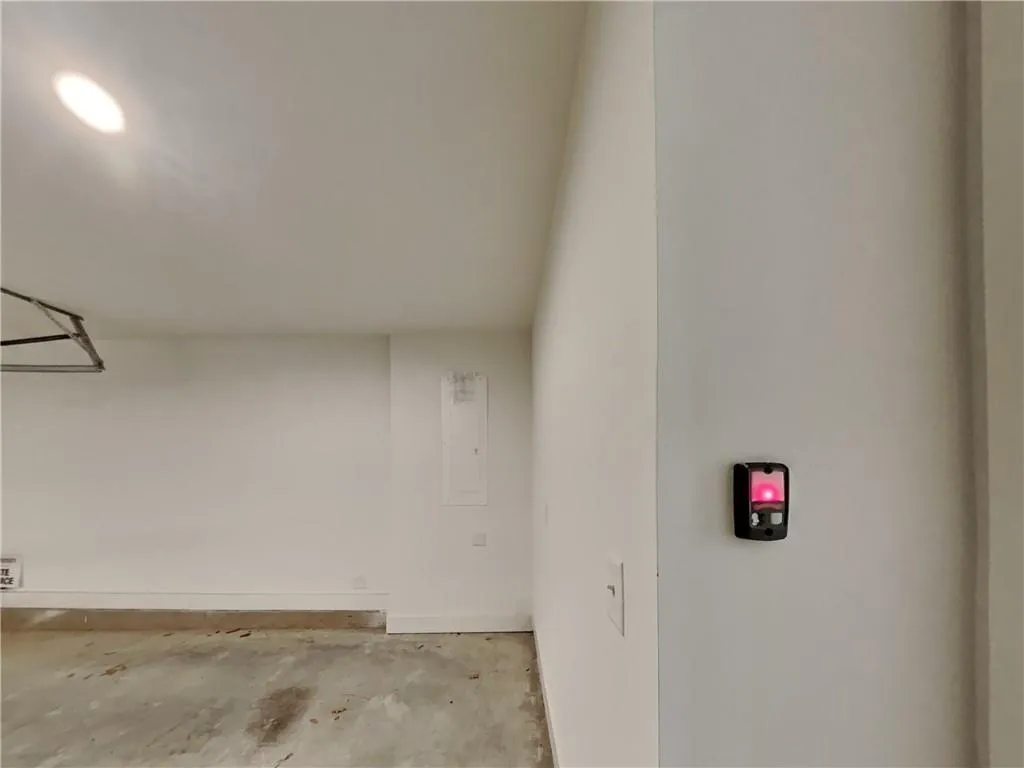 Garage featuring baseboards