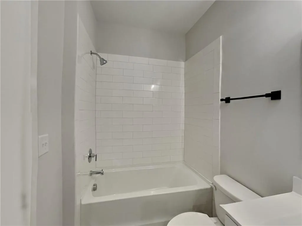 Full bath with bathing tub / shower combination and vanity