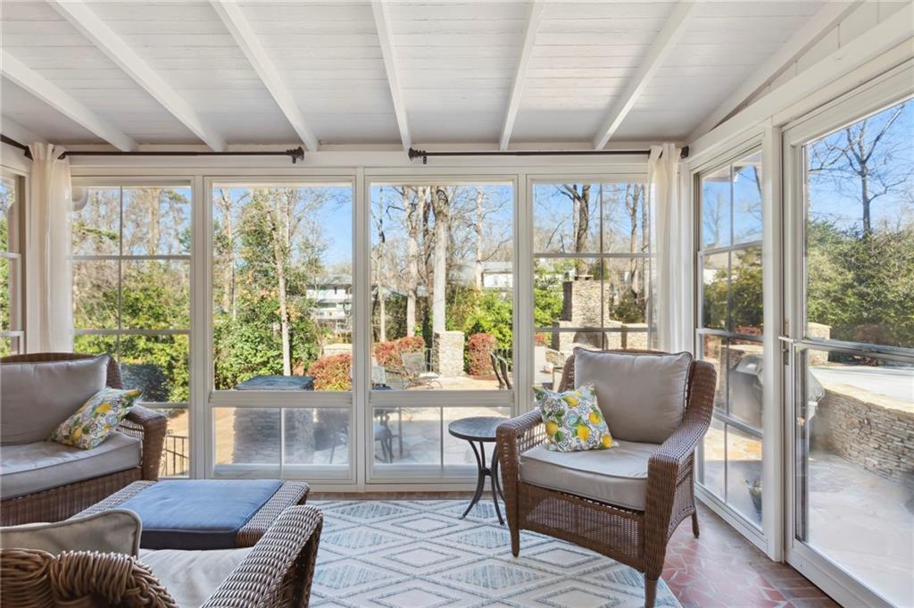 All-Season Porch: Enclosed screened porch with Pella oversized slider windows with screens and installed new door.