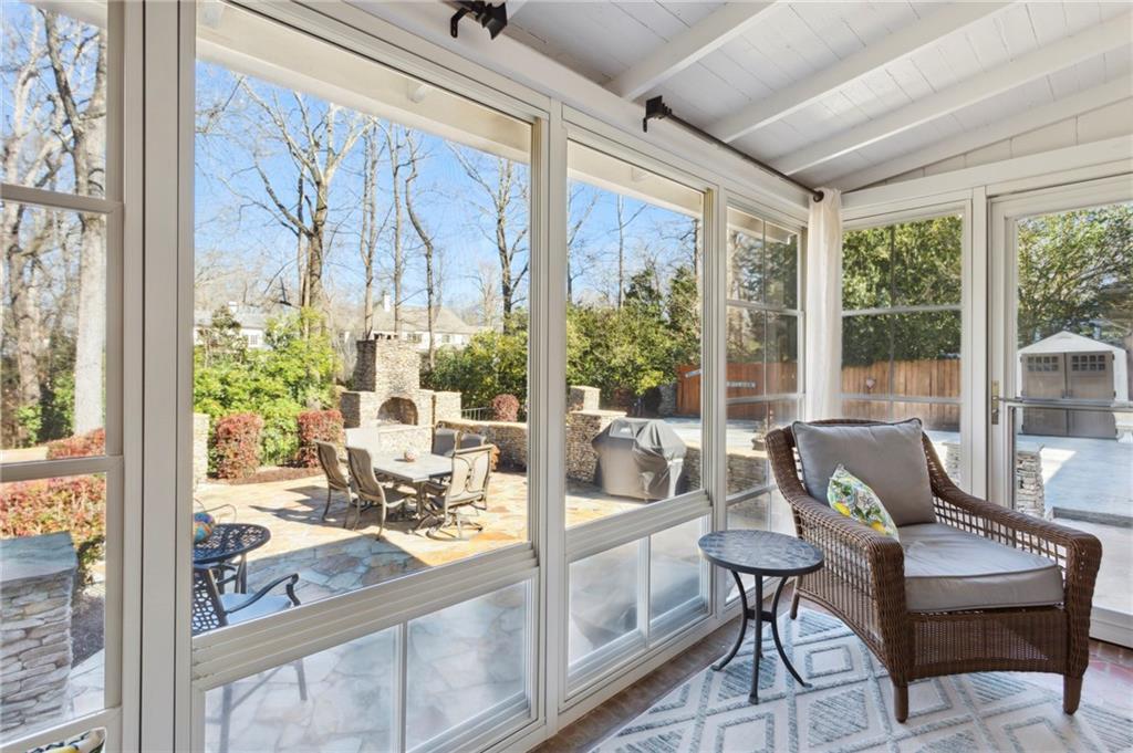 All-Season Porch: Enclosed screened porch with Pella oversized slider windows with screens and installed new door.