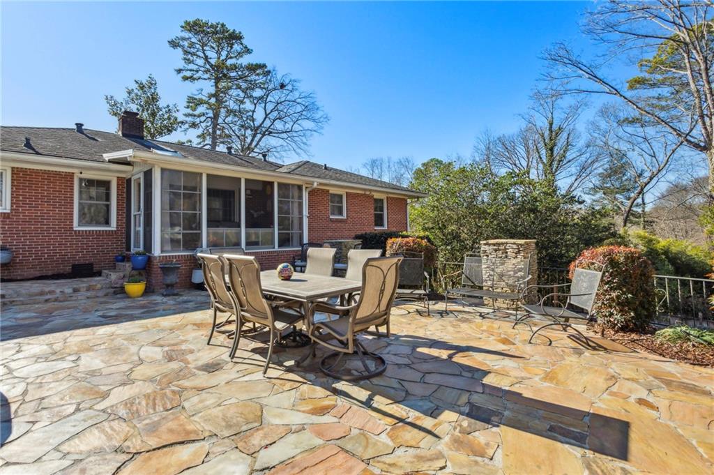 Flagstone patio with fireplace overlooking rear yard
