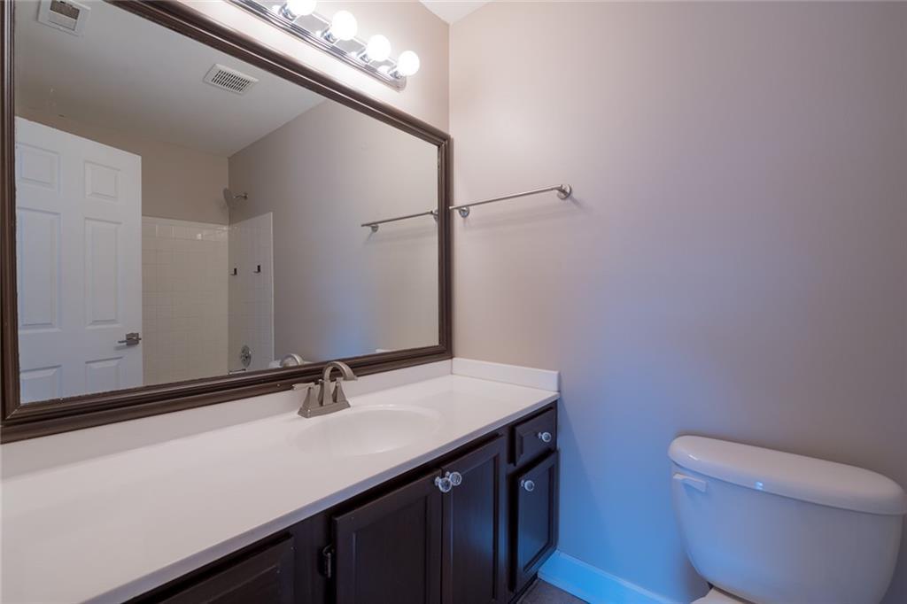 Bathroom with vanity and toilet