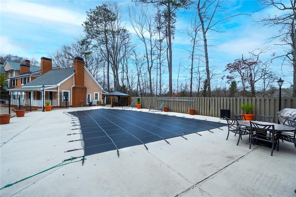 View of swimming pool with a patio