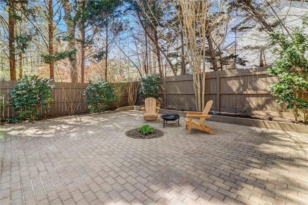 View of patio featuring a fire pit