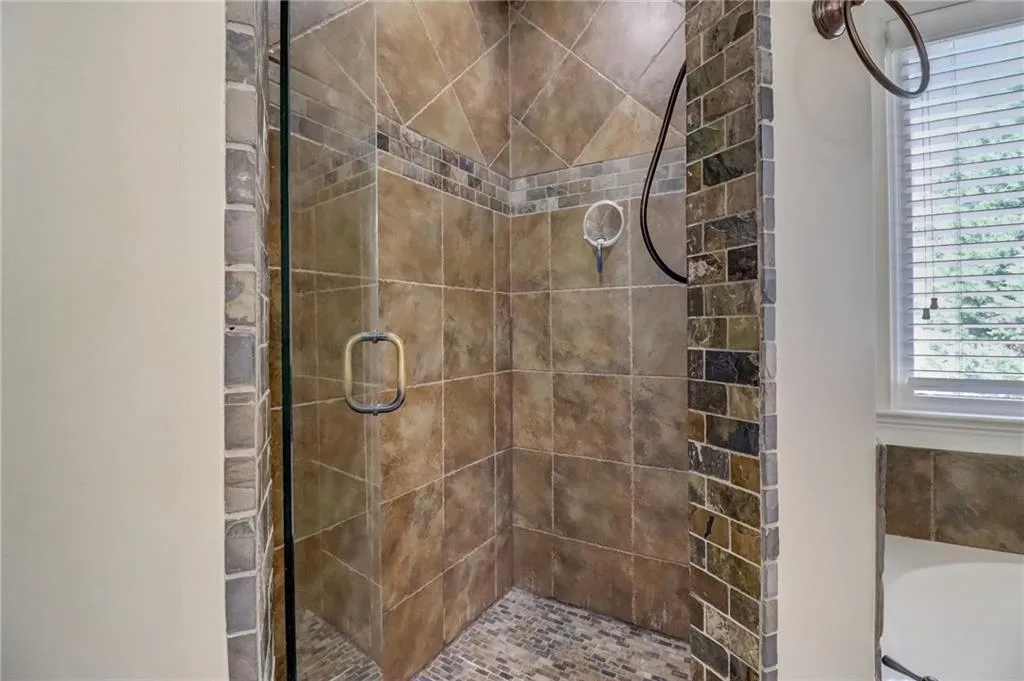 Bathroom featuring an enclosed shower