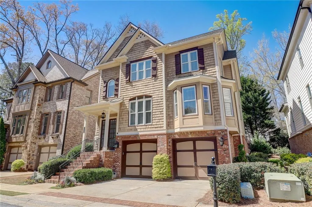 View of front facade featuring a garage