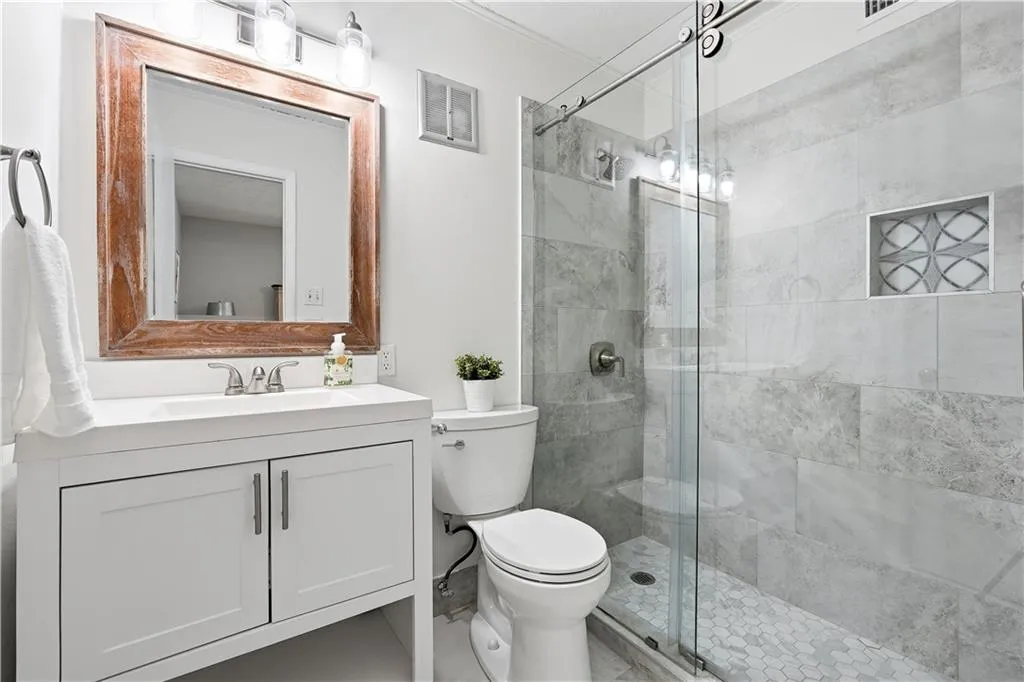 Primary En suite with renovated shower, vanity and fixtures