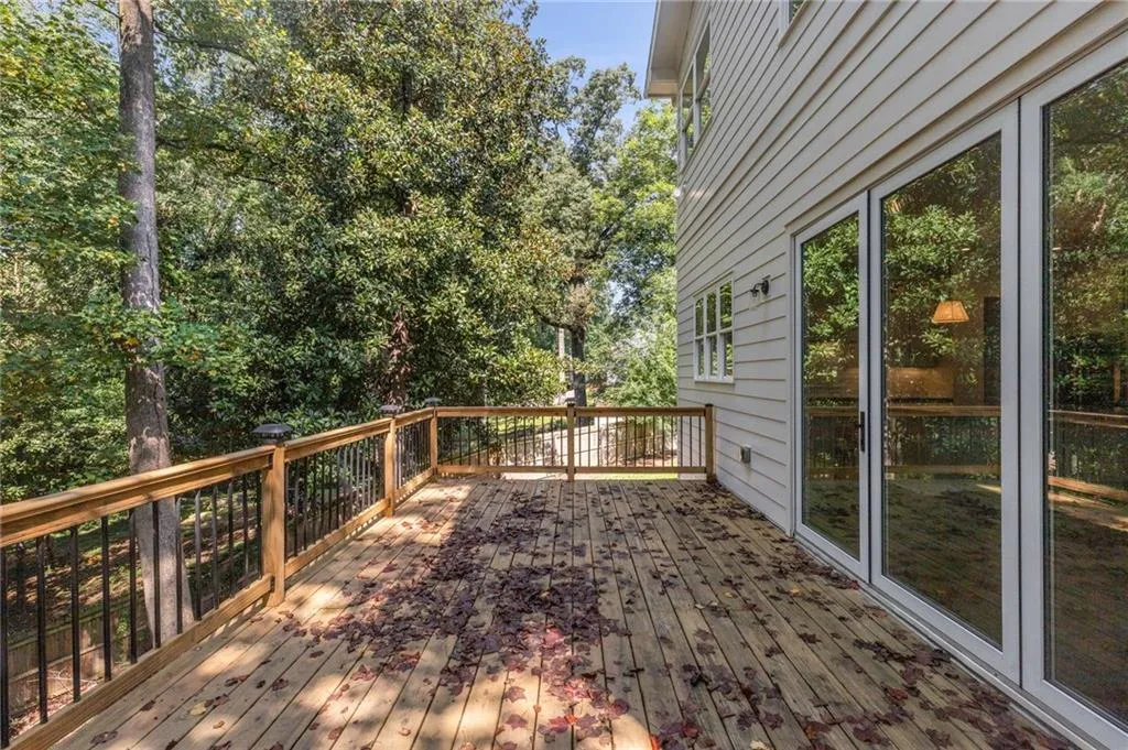 Deck with view of wooded area