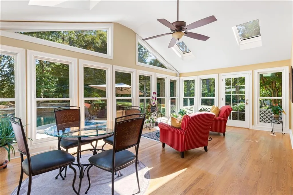Vaulted Sunroom with Skylights and side porches.
