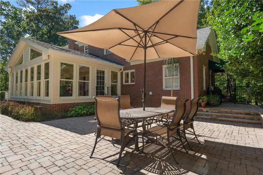 Stunning Vaulted Sunroom walks out to large side patio.