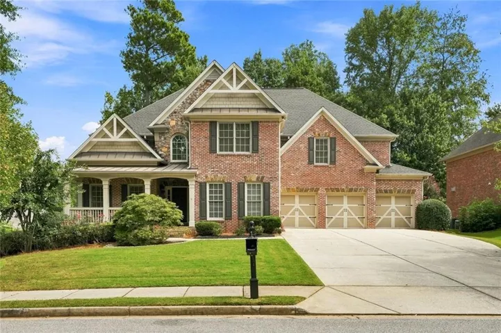 Brick exterior with stone accents and decorative gables