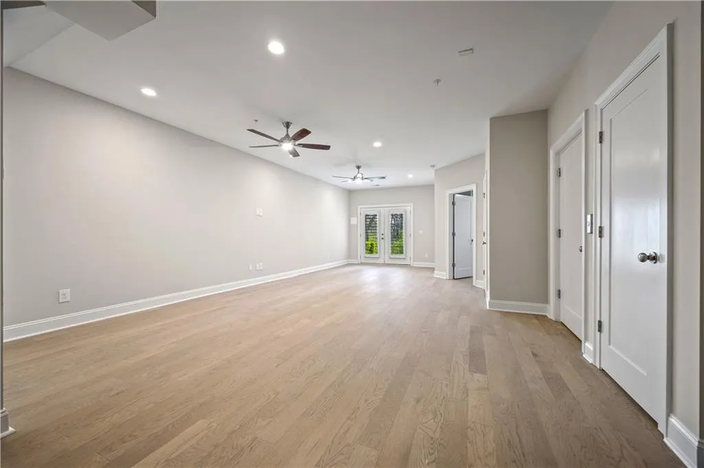 Finished Terrace level with recessed lighting, baseboards, light wood finished floors, and ceiling fan