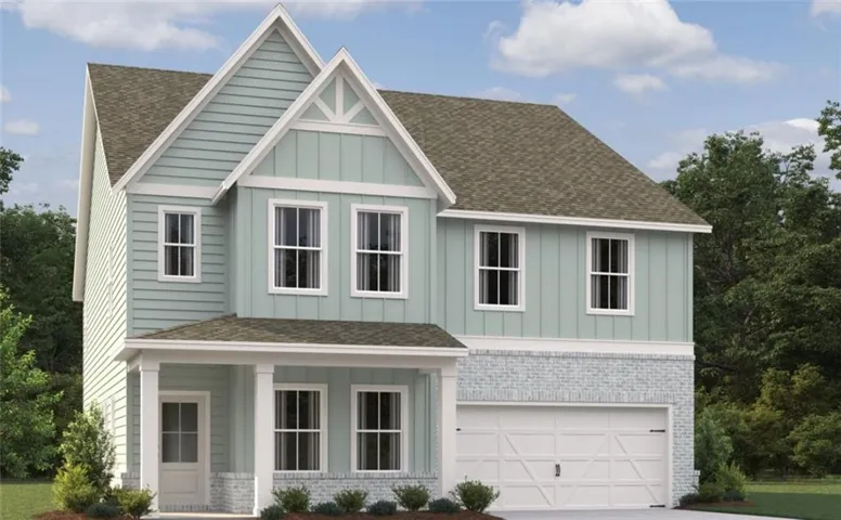 Two-story residence featuring light blue siding with white trim, a covered front porch with white columns, and a two-car garage
