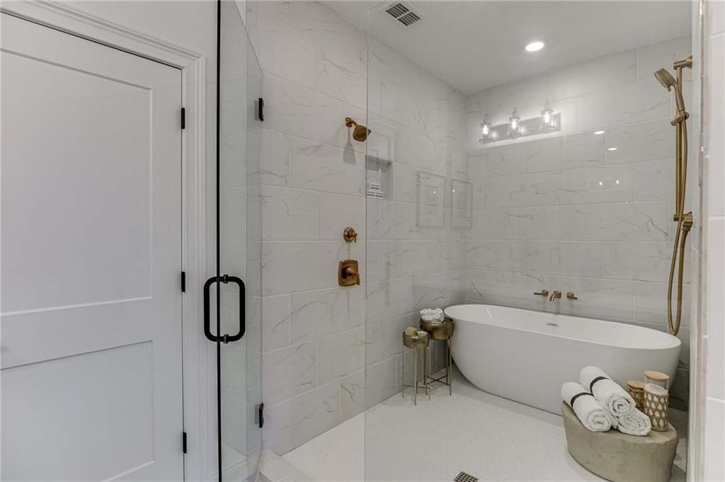 Lavish Primary Bath has a large shower with free standing tub