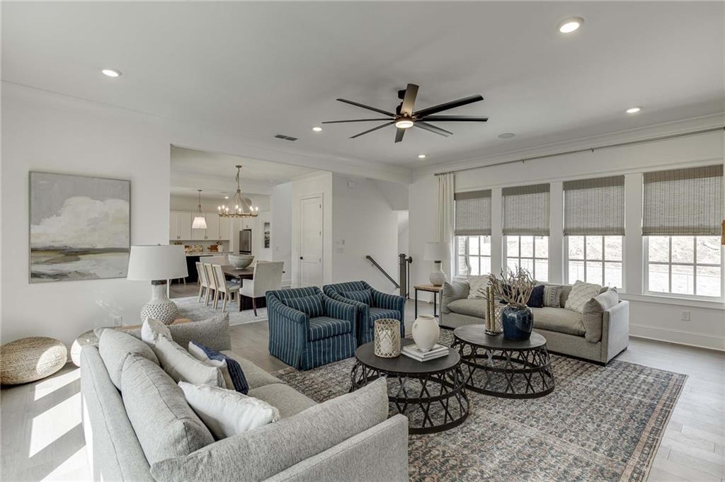 Wonderful Living Room on Main level of home features can lighting and upgrade hardwood floors.