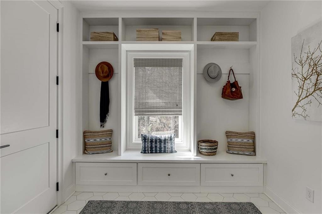 The mud room off the garage has built ins!