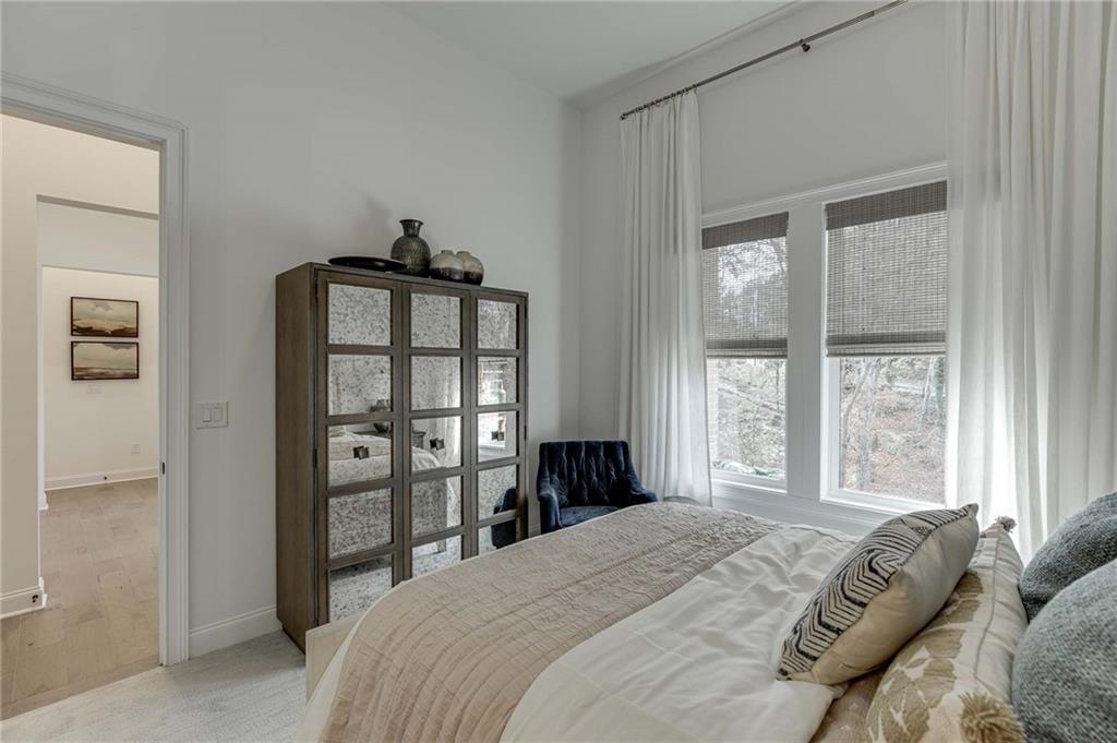The basement Bedroom has 12 foot ceiling and upgrade carpetry and pad.