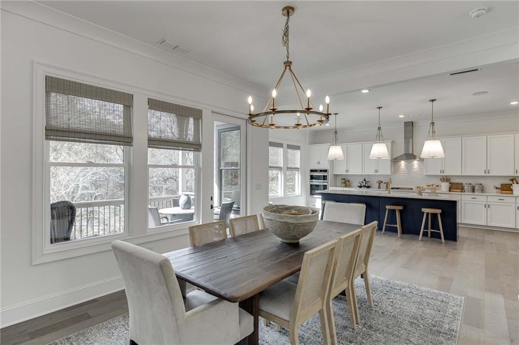 The dining room is central on the main level with views to the rear covered porch.