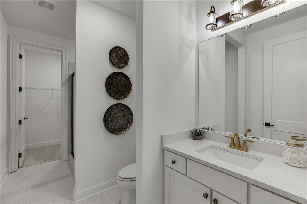 Terrace Full Bath has frameless shower and spacious vanity.