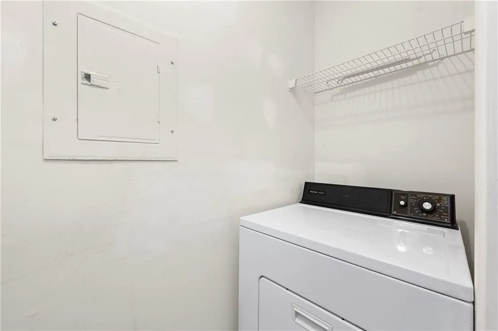 Laundry area with washer / dryer and electric panel