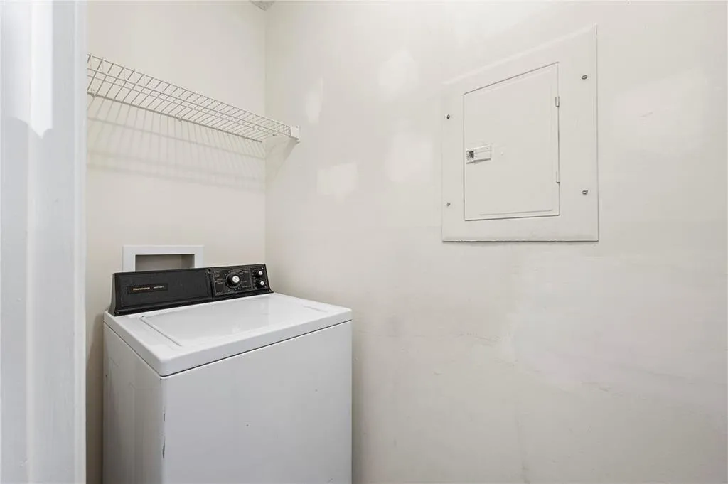 Laundry room with washer / dryer and electric panel
