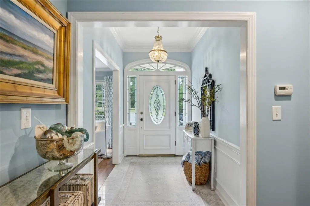 Beautiful inside entry area with crystal chandelie