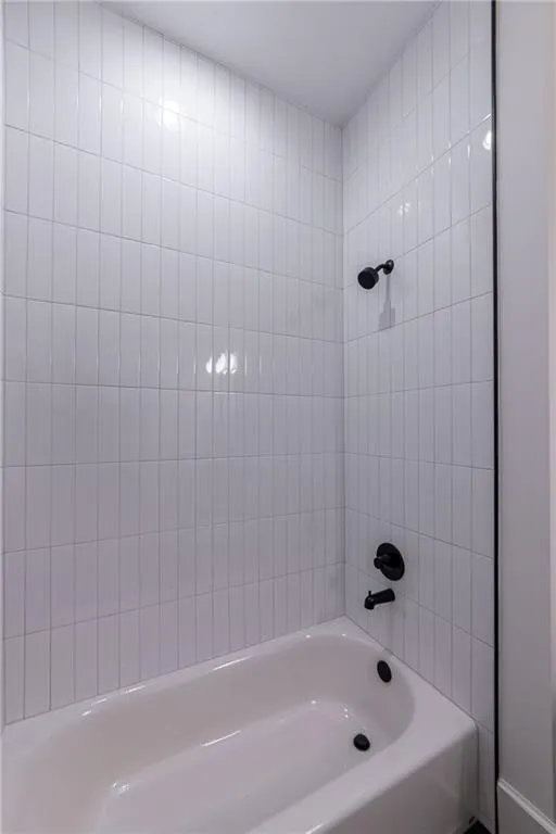 Bathroom featuring shower / bathtub combination
