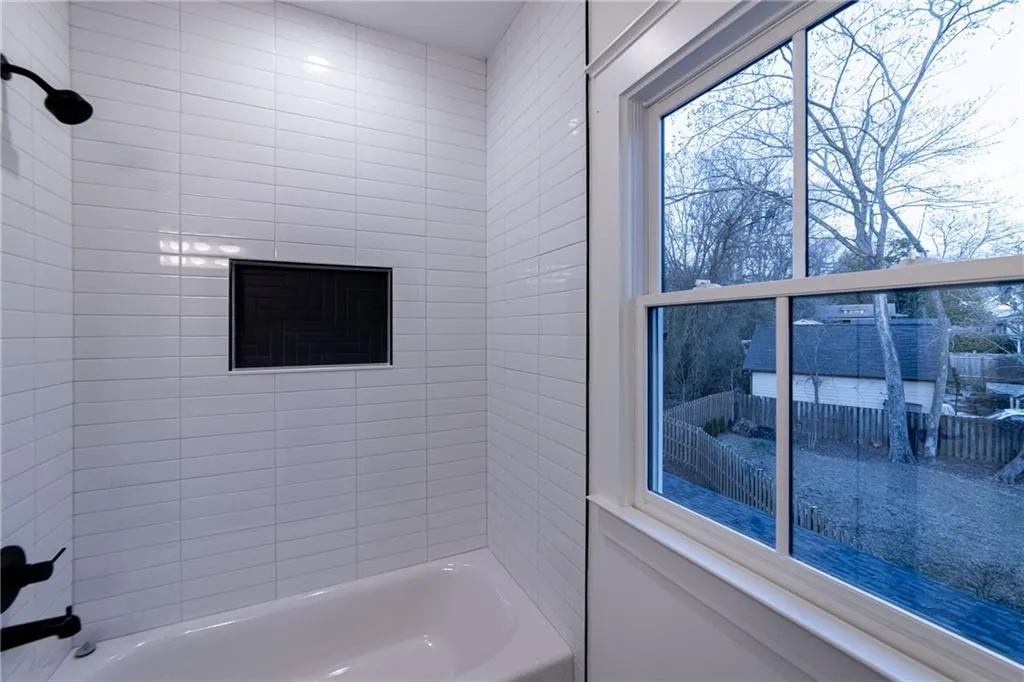 Full bath featuring shower / tub combination